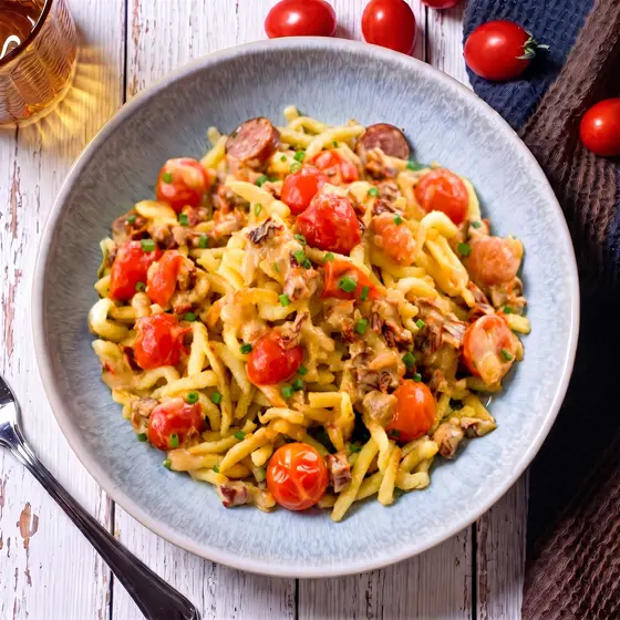 Spätzli pan with smoked sausage